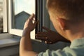 Construction worker putting sealing foam tape on window indoors, closeup Royalty Free Stock Photo