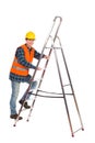 Construction worker in reflective clothing climbing a ladder. Royalty Free Stock Photo