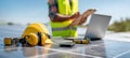 The construction worker reviewing solar panel systems with safety gear and technology. AI generated image Royalty Free Stock Photo