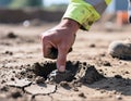 Worker Testing Soil Consistency at Worksite, generative ai Royalty Free Stock Photo
