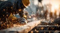 Construction worker in safety gear uses power tool, creating bright sparks in dynamic, industrial setting Royalty Free Stock Photo