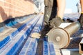 Construction worker sawing steel sheet Royalty Free Stock Photo