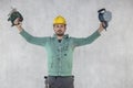 The construction worker shows the tools necessary for his work