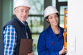 Construction worker smile and posing with spirit level Royalty Free Stock Photo