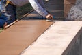 Construction Worker Smoothing Wet Cement With Hand Edger Tool Royalty Free Stock Photo