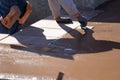 Construction Worker Smoothing Wet Cement With Hand Edger Tool Royalty Free Stock Photo