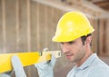 Construction Worker with spirit level in front of construction site Royalty Free Stock Photo