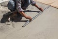 Construction worker spreading wet concrete Royalty Free Stock Photo