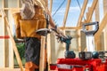 Construction Worker Preparing Tools at a Building Site on a Sunny Day in Early Summer Royalty Free Stock Photo