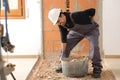 Construction worker suffering back ache lifting work carrycot Royalty Free Stock Photo