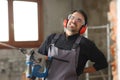 Construction worker suffering back ache working in a house Royalty Free Stock Photo