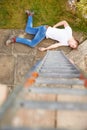 Construction Worker Suffering Injury After Fall From Ladder Royalty Free Stock Photo