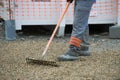 Construction worker sweeping on the building construction site Royalty Free Stock Photo