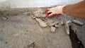 Construction worker sweeping debris with broom and dustpan Royalty Free Stock Photo