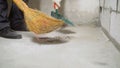 Construction worker sweeping dust with broom and dustpan Royalty Free Stock Photo