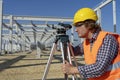 Construction Worker With Tacheometer Working at Construction Site