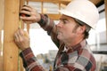 Construction Worker Takes Measurments Royalty Free Stock Photo