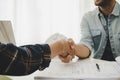 Construction worker team contractor handshake after finishing business meeting to start up project contract in construction site b Royalty Free Stock Photo