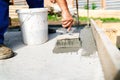 construction worker using brush and primer for hydroisolating and waterproofing house Royalty Free Stock Photo