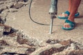 Construction worker using concrete drilling machine in construct Royalty Free Stock Photo