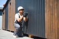 Construction worker using cordless drill installing modular house panel Royalty Free Stock Photo