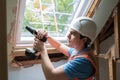 Construction Worker Using Drill To Install Replacement Window Royalty Free Stock Photo