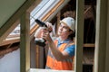 Construction Worker Using Drill To Install Replacement Window Royalty Free Stock Photo