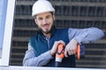 construction worker using drill to install window Royalty Free Stock Photo