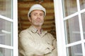 Construction worker using drill to install window Royalty Free Stock Photo