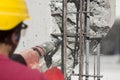 Construction worker using a drilling power tool Royalty Free Stock Photo