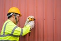 A construction worker using electric drill install new roof with Metal Sheet Royalty Free Stock Photo