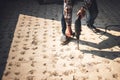 Construction worker Using an electric drill to drill the floor Royalty Free Stock Photo