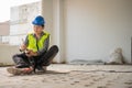 Construction worker Using an electric jackhammer to drill perforator equipment making holes before pouring the floor to be strong Royalty Free Stock Photo