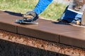 Construction Worker Using Hand Groover On Wet Cement Forming Coping Around New Pool Royalty Free Stock Photo