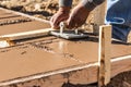 Worker Using Hand Groover On Wet Cement Forming Coping Around New Pool Royalty Free Stock Photo