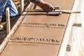 Worker Using Hand Groover On Wet Cement Forming Coping Around New Pool Royalty Free Stock Photo