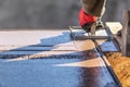 Worker Using Hand Groover On Wet Cement Forming Coping Around New Pool Royalty Free Stock Photo