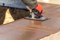 Construction Worker Using Hand Groover On Wet Cement Forming Coping Around New Pool Royalty Free Stock Photo