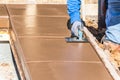 Construction Worker Using Hand Groover On Wet Cement Forming Coping Around New Pool Royalty Free Stock Photo