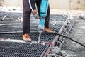 Construction worker using jackhammer drill floor cement