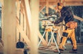 Construction Worker Using Large Powerful Circular Saw