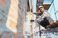 Construction worker using level tool for window installation Royalty Free Stock Photo