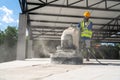 A Construction worker using machine polishing surface floor smoothing and finishing hardener or epoxy concrete at construction Royalty Free Stock Photo