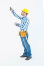 Construction worker using measure tape Royalty Free Stock Photo