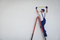 Construction worker using measuring tape indoors. Room renovation Royalty Free Stock Photo