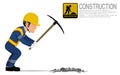 A construction worker is using pickaxe for digging hole on the ground Royalty Free Stock Photo