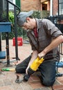 Worker Sawing Off Old Mount Royalty Free Stock Photo