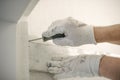 Construction worker using spirit level at home interior Royalty Free Stock Photo