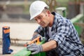 construction worker using spirit level in new house Royalty Free Stock Photo