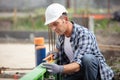 construction worker using spirit level on site Royalty Free Stock Photo